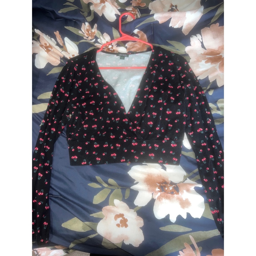 Cropped cherry long sleeve top.